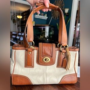 Coach Hampton’s Signature Stitched Carryall Flap Satchel